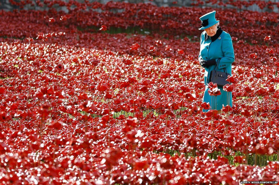 Britain's Queen Elizabeth at a Tower of London art installation featuring thousands of ceramic poppies
