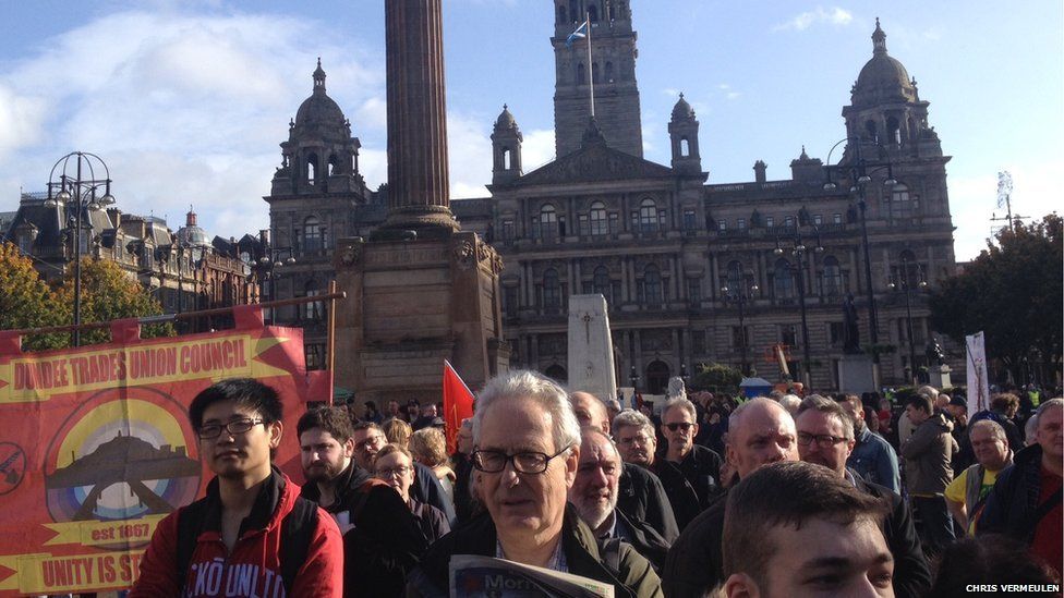 Demonstrators march in Glasgow