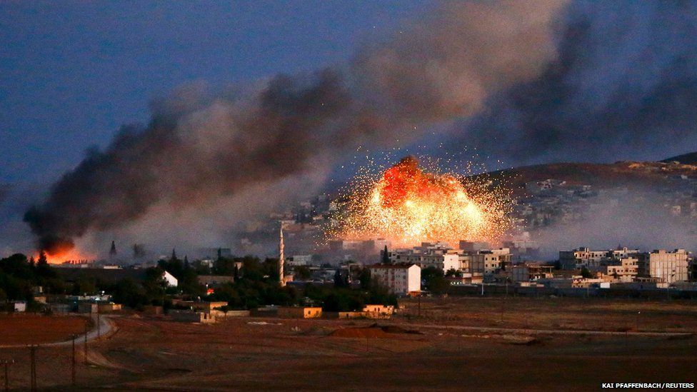Smoke and flames rise over Syrian town of Kobana after an airstrike