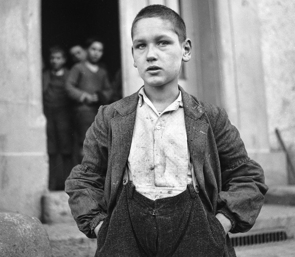 Archive photo of boy in ill-fitting clothes