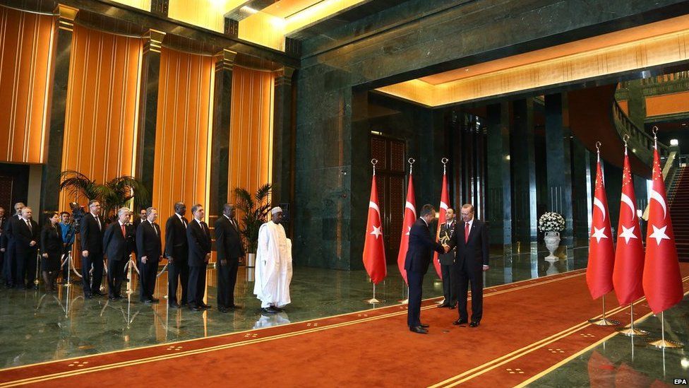 Turkish President Recep Tayyip Erdogan welcomes visitors at the Ak Saray residence
