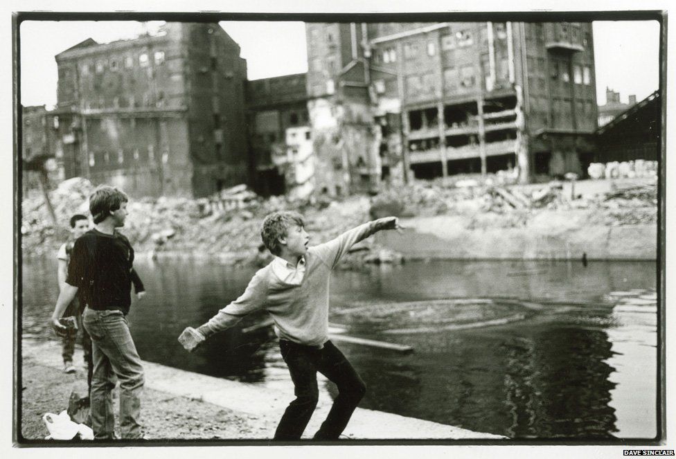 Lad throwing rock into Leeds-Liverpool canal