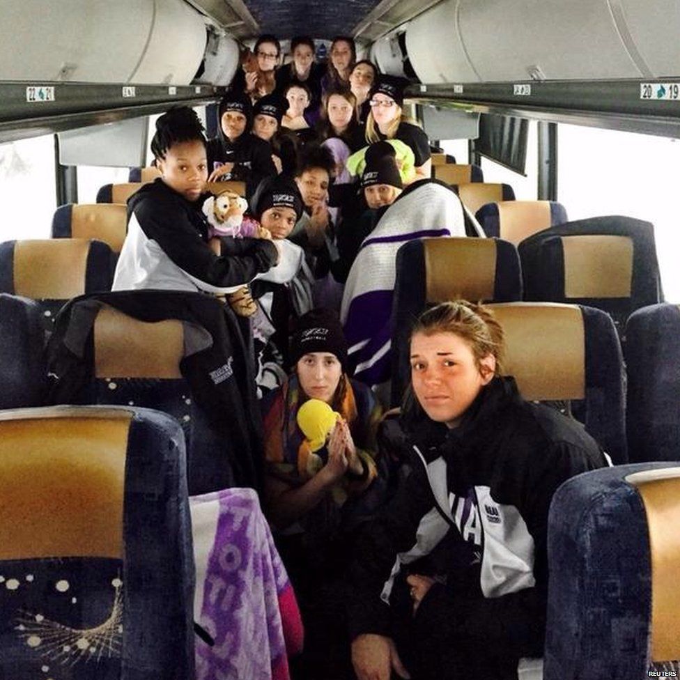 Members of the Niagara University women's basketball team stranded aboard their bus in New York State (18 November 2014)