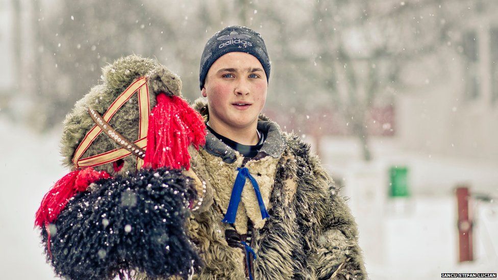 Romanian boy wearing a bear-like costume
