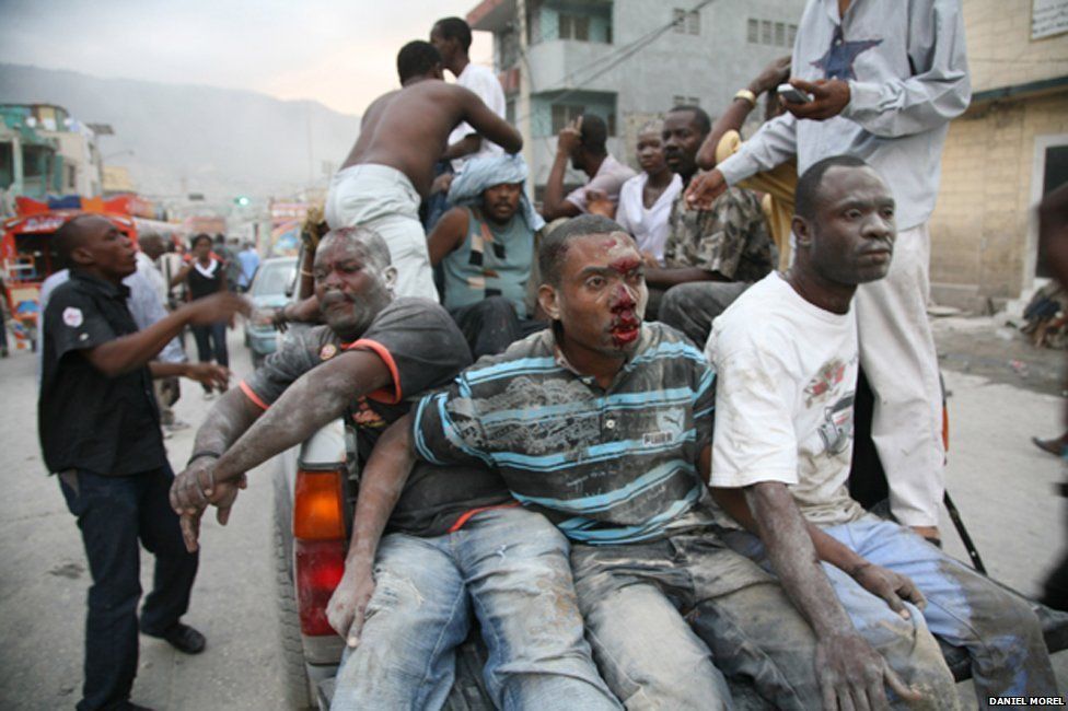 Injured people on the back of a truck just after the Haiti earthquake