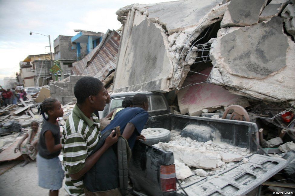People in a ruined street just after the Haiti earthquake