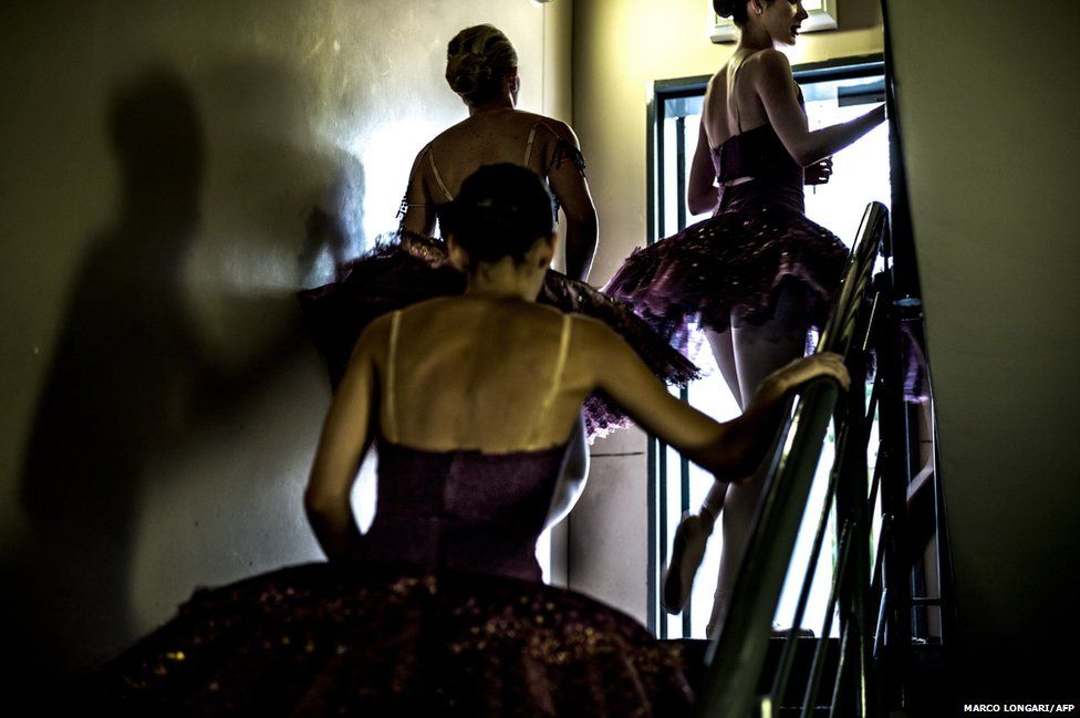 Members of the Joburg Ballet rush backstage