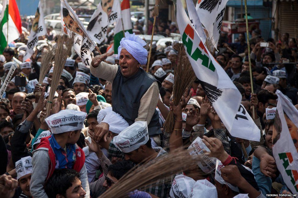 An elderly supporter of the Aam Aadmi Party, or Common Man's Party, celebrates his party's victory in New Delhi, India