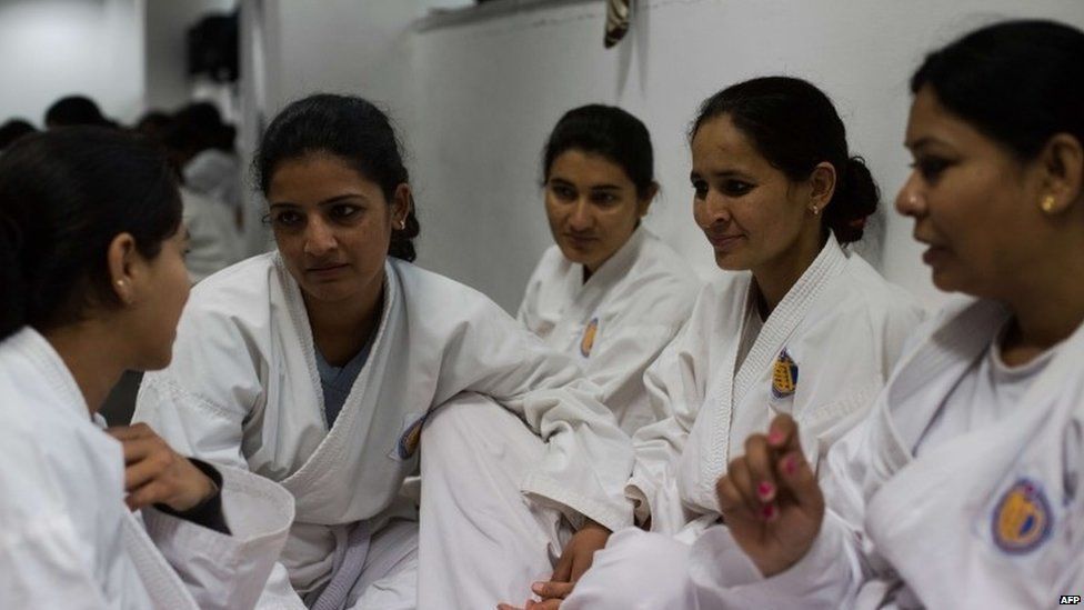 Indian policewomen talk during a break as they take part in a self-defence class in New Delhi.