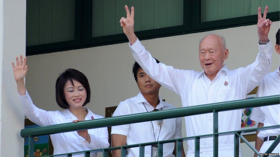 Singapore Minister mentor Lee Kuan Yew gives the victory sign to his supporters upon arriving at the nomination centre to file his candidacy for Tanjong Pagar ahead of Singapore's May 7 general election (27 April 2011)