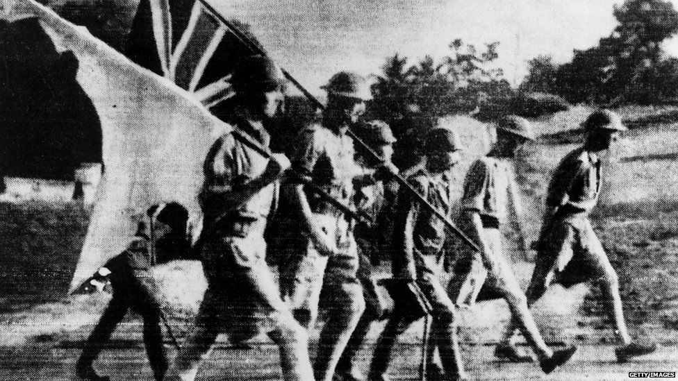 Japanese troops escort surrendering British soldiers in Singapore (1 Feb 1942)