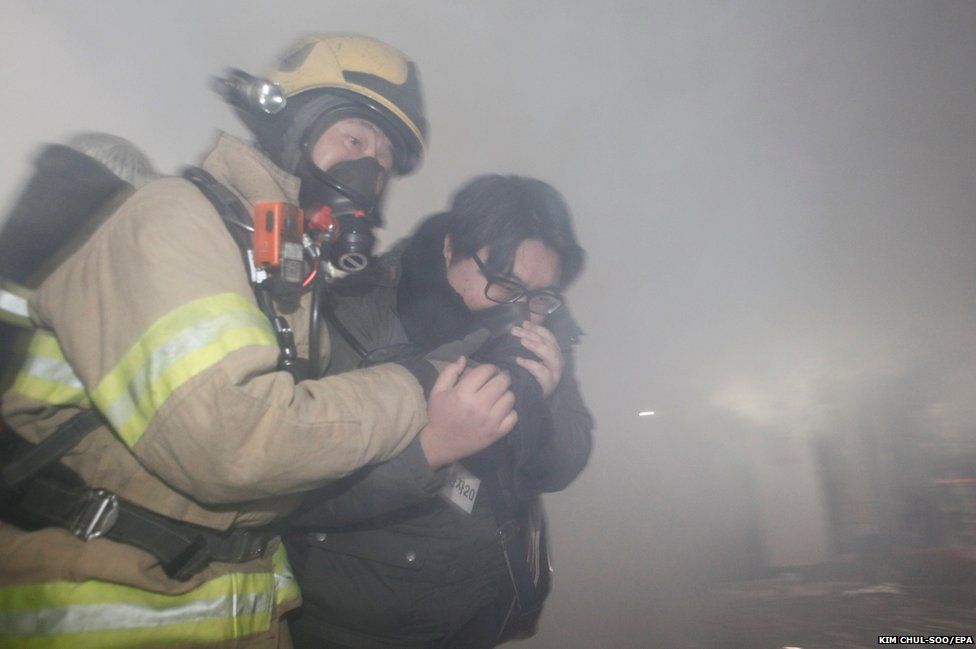 South Korean firefighters help a victim during an anti-terrorism drill