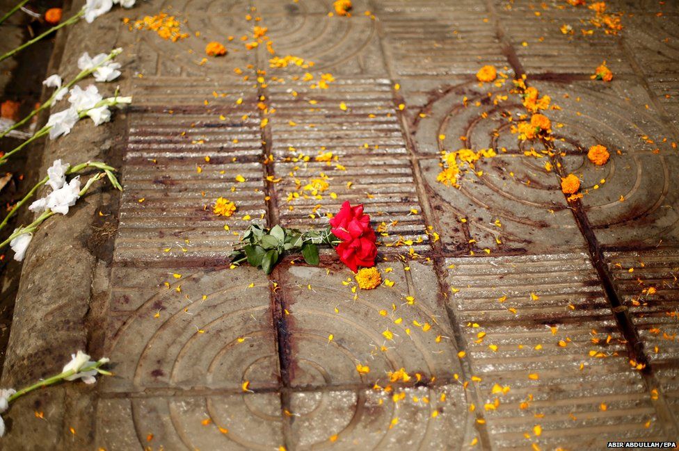 Flowers mark the spot where Bangladeshi blogger Avijit Roy was killed