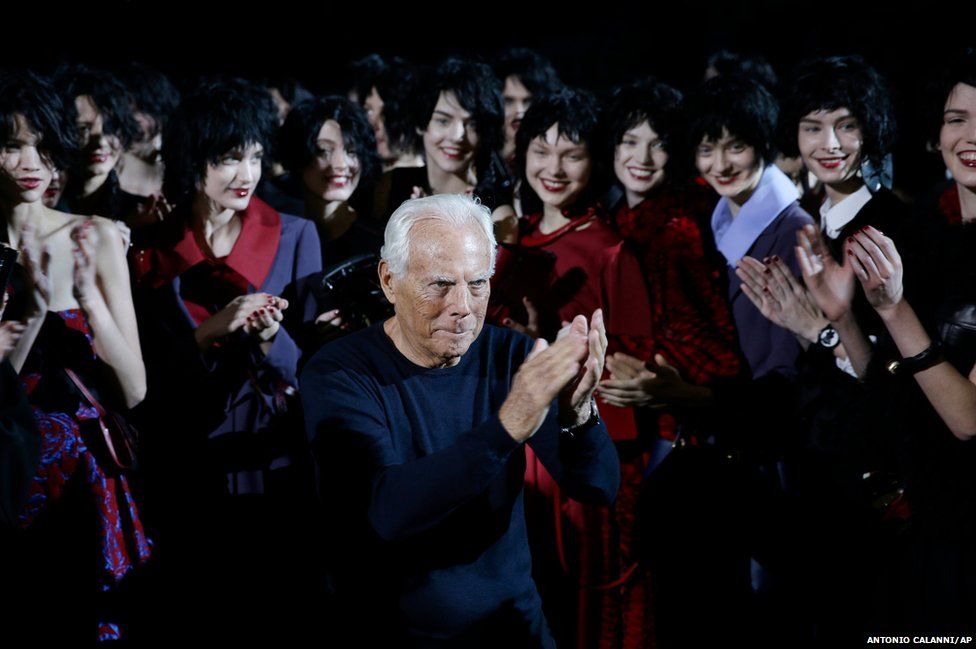 Italian fashion designer Giorgio Armani poses with his models