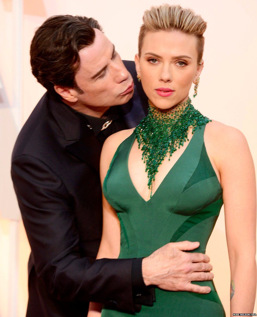 John Travolta kisses Scarlett Johansson