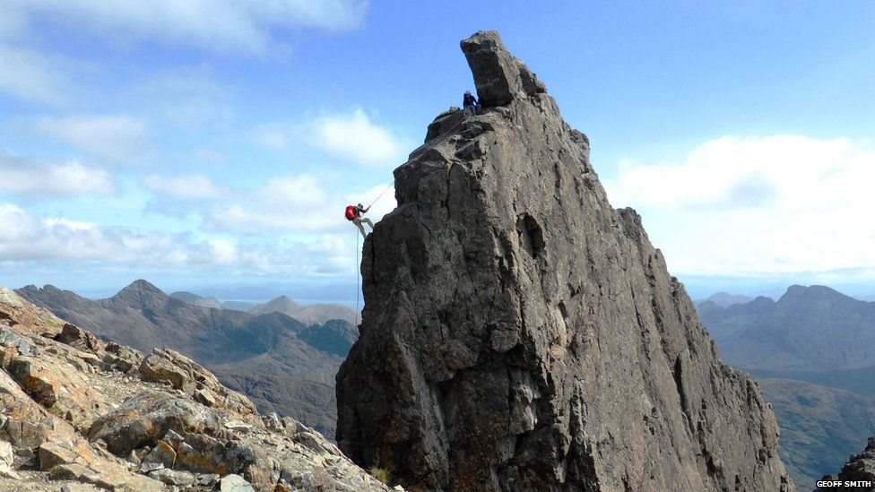 A climber abseiling off the Inaccessible Pinnacle