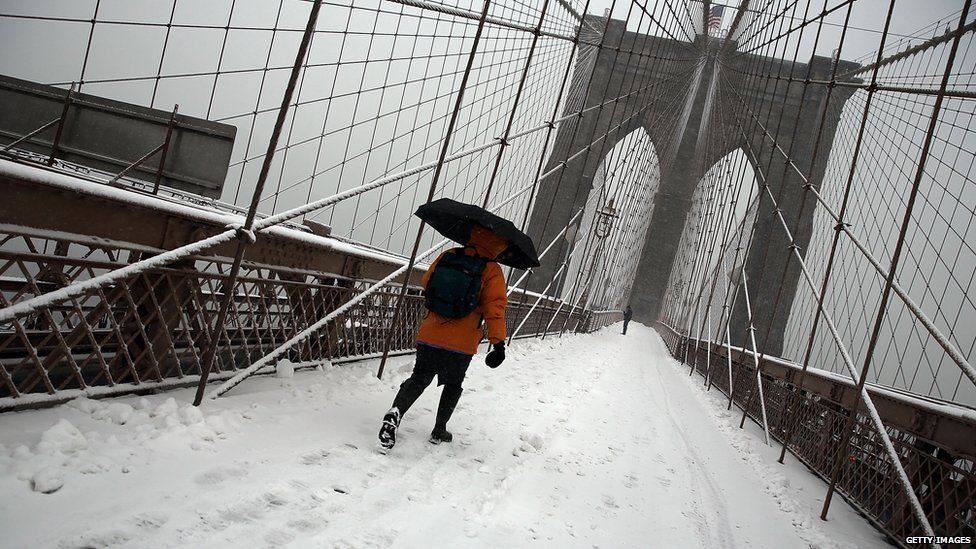 Brooklyn Bridge snow with person walking