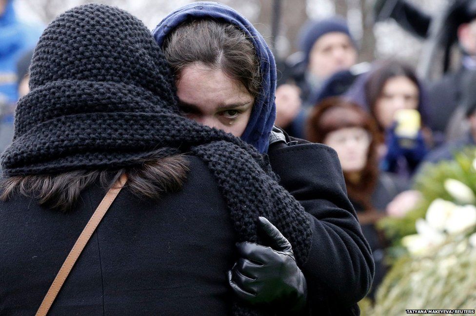 Zhanna, daughter of Russian leading opposition figure Boris Nemtsov, reacts during his funeral in Moscow