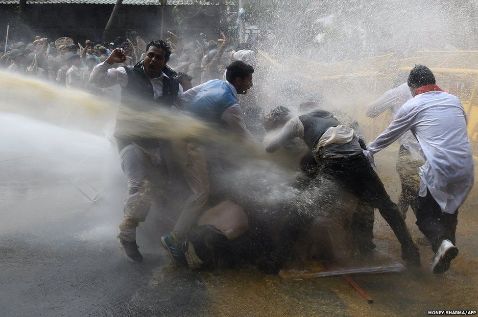 Police use water cannon to disperse protesters led by the opposition Congress party in New Delhi