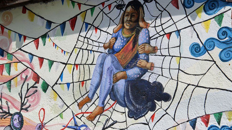Woman trapped in spider web by the Kolor Kathmandu collective