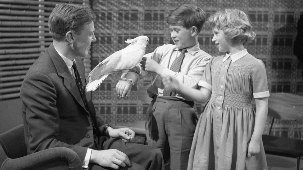 Prince Charles and Princess Anne being introduced to Cocky the cockatoo by David Attenborough