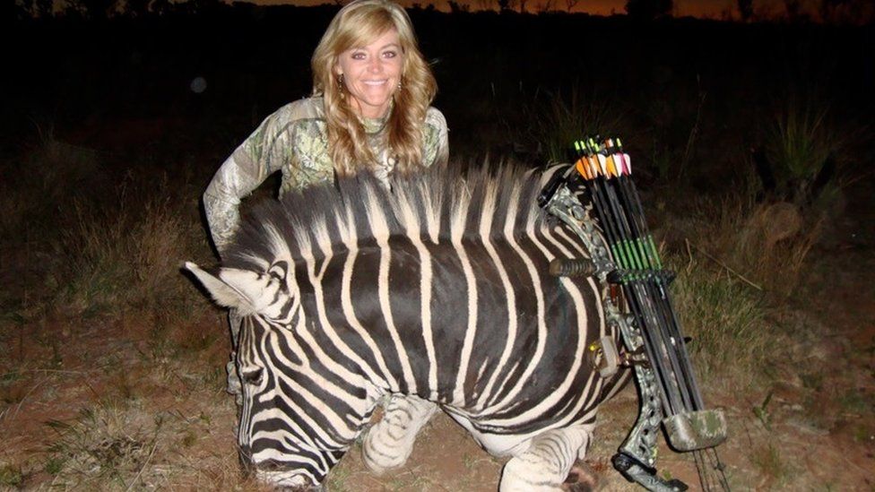 Rebecca Francis poses with a zebra she killed