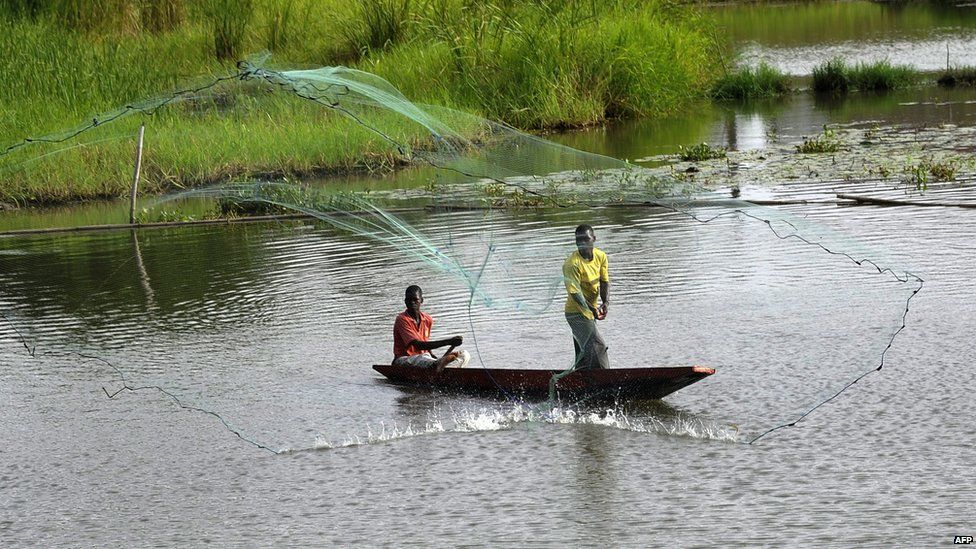 Fishermen in a lagoon in Grand Bassam - Tuesday 21 April 2015