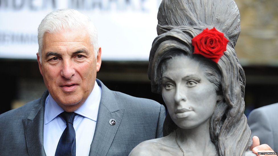 Mitch Winehouse with a statue of Amy
