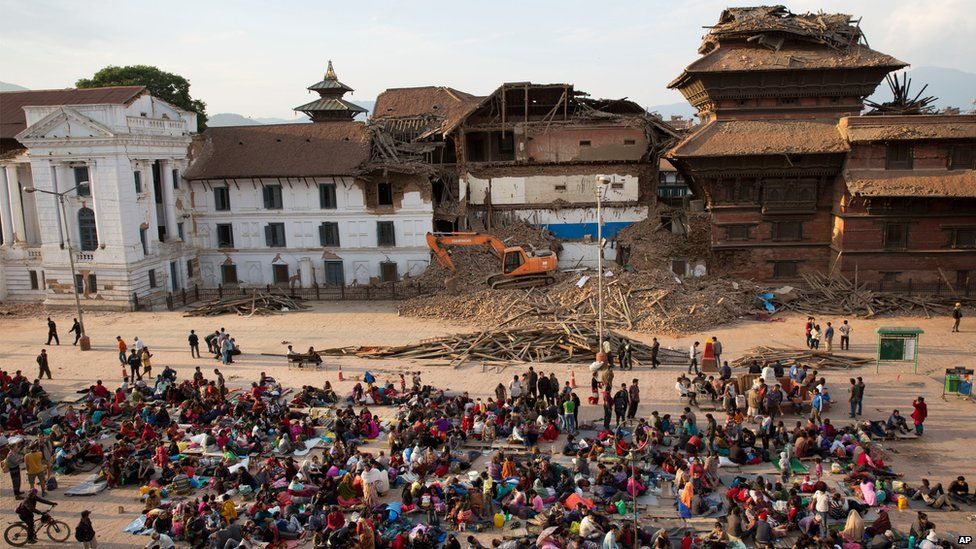 People gather on an open space for security reasons at the Basantapur Durbar Square, damaged in Saturday's earthquake in Kathmandu, Nepal (April 26, 2015)