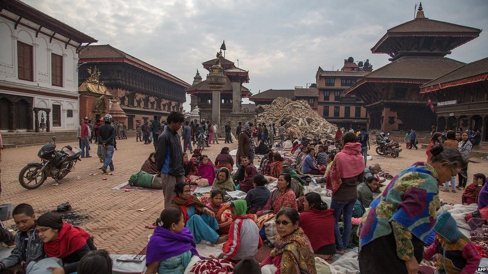 Residents sit in a square on April 26, 2015 in Bhaktapur, Nepal