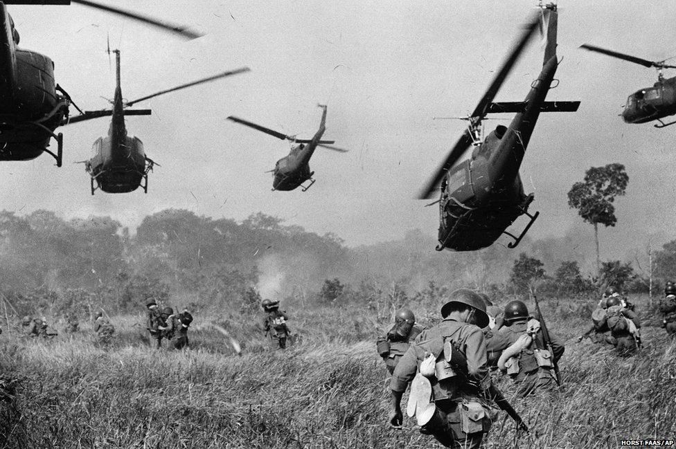 Hovering US Army helicopters pour machine-gun fire into the tree line to cover the advance of South Vietnamese ground troops as they attack a Viet Cong north of Tay Ninh, near the Cambodian border, March 1965
