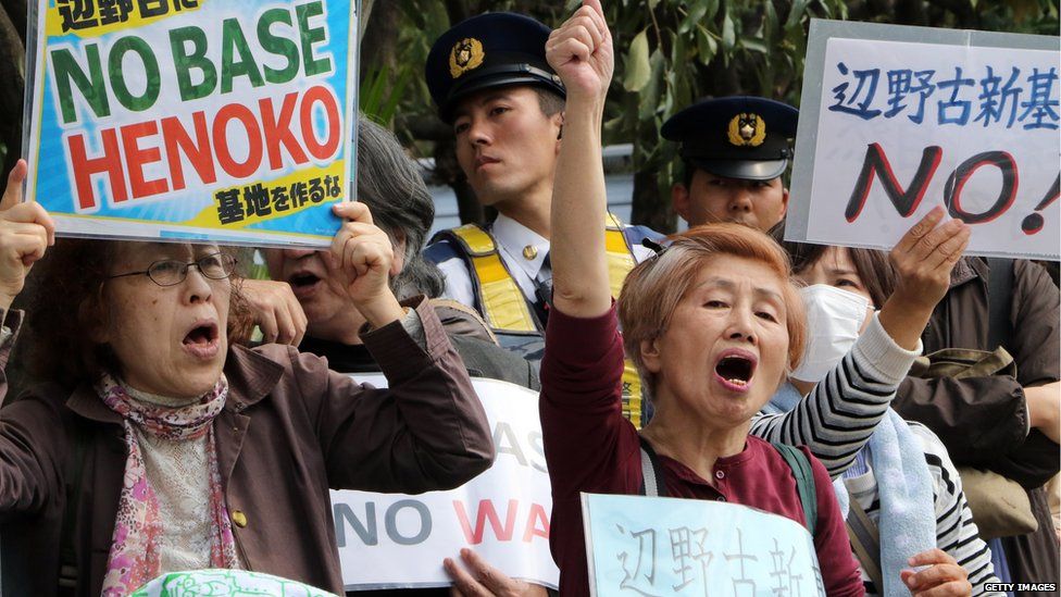 Some 100 anti-US base activists shout slogans as they protest against the construction of the new base in Okinawa during a rally in front of the prime minister's official residence in Tokyo on April 17, 2015 as Okinawa Governor Takeshi Onaga met with Prime Minister Shinzo Abe.