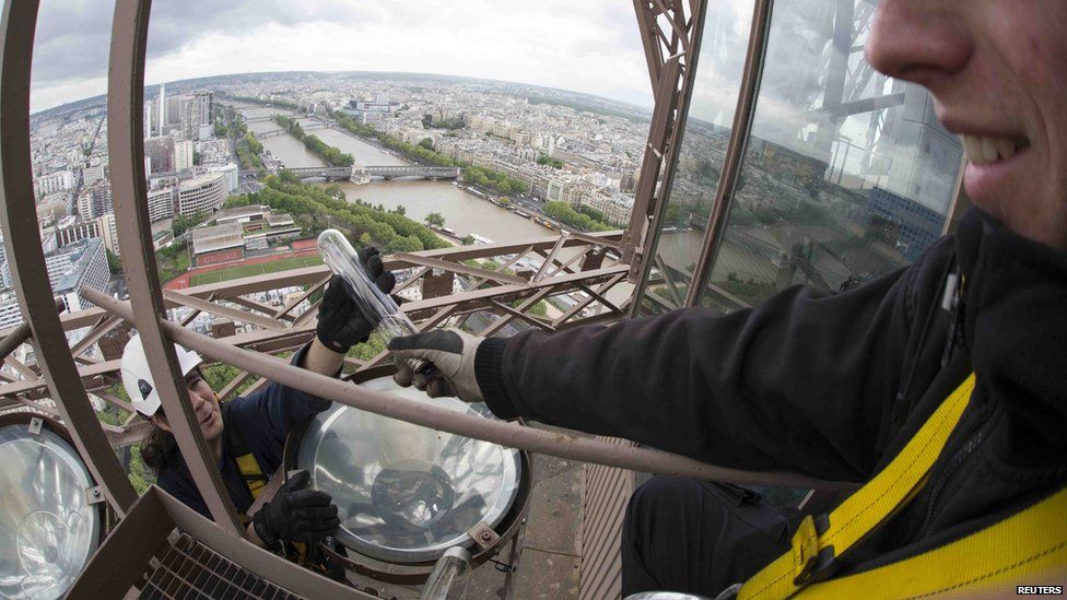 Changing the light bulbs on the Eiffel Tower in Paris BBC Newsround