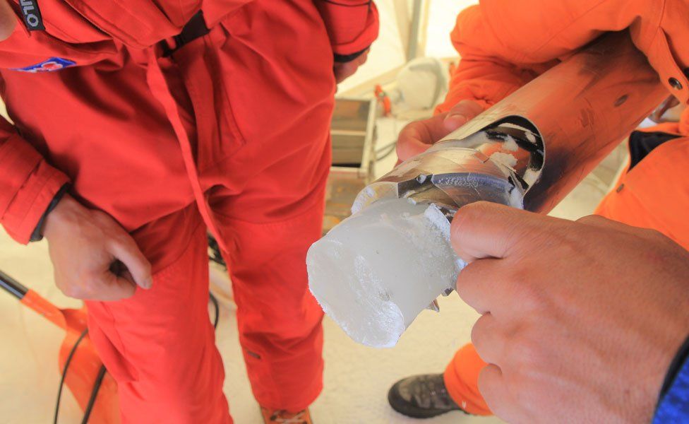 An ice core in the drilling chamber