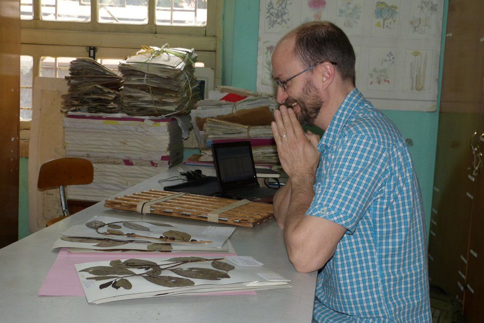 Dr Aaron Davis with some coffee samples at Kew