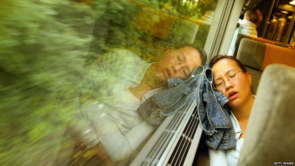 A woman sleeps on Eurostar