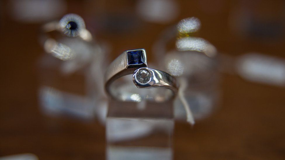 A sapphire ring on display