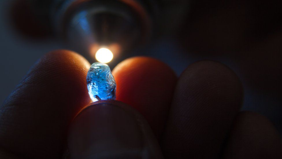 A sapphire stone under inspection