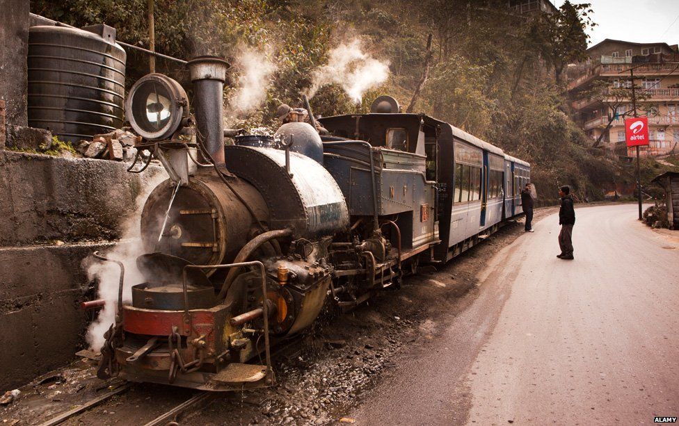 Darjeeling Himalayan Mountain Railway steam train taking on water