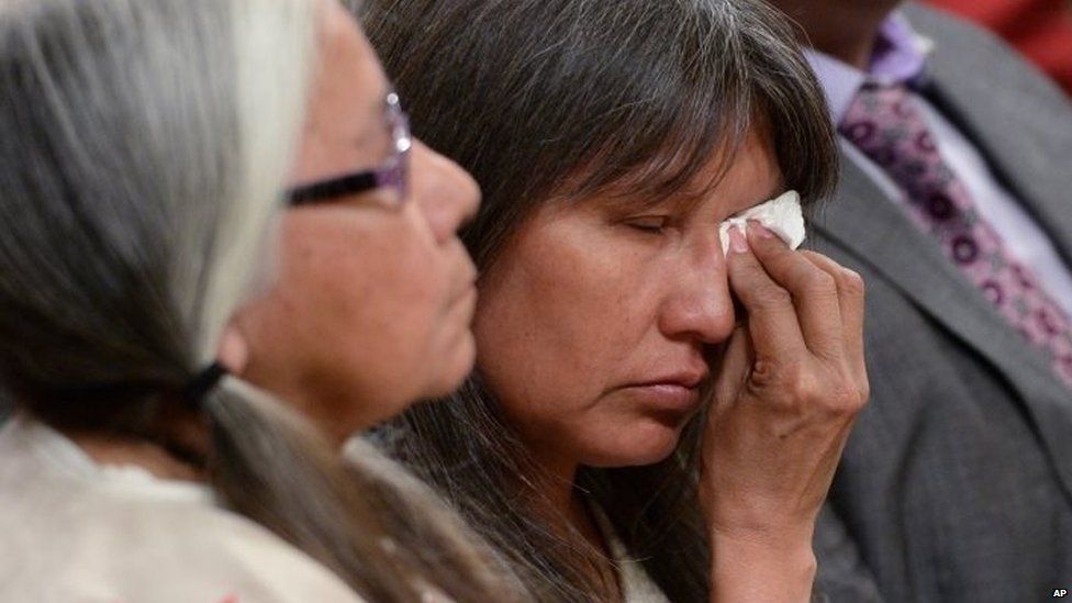 A woman wipes a tear during the closing ceremony of the Indian Residential Schools Truth and Reconciliation Commission, at Rideau Hall in Ottawa on 3 June.