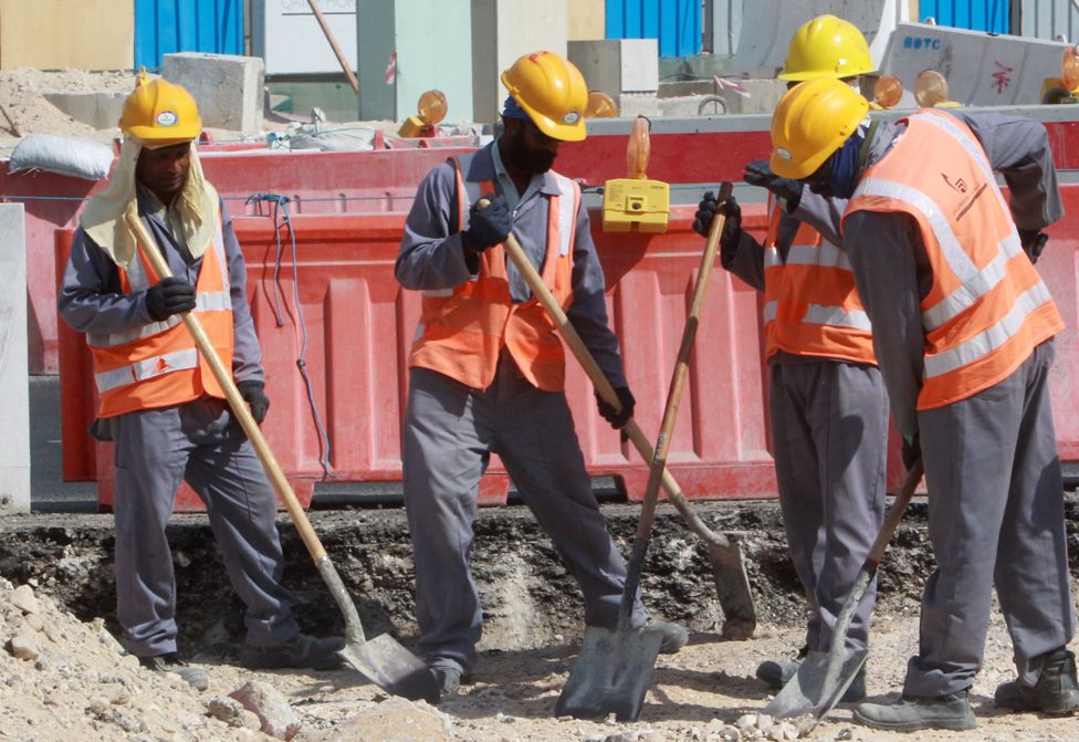 Workers at work on the Qatar construction site