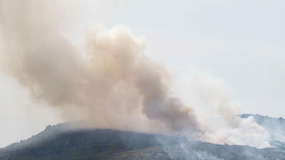 Plumes of smoke rise from the moorland in Meltham