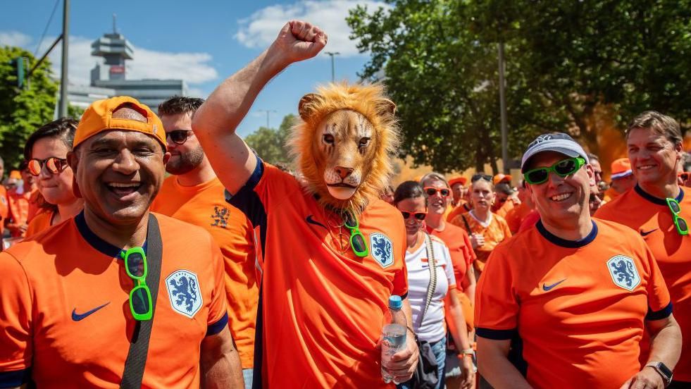 Dutch fans marching to a game in Germany at Euro 2024
