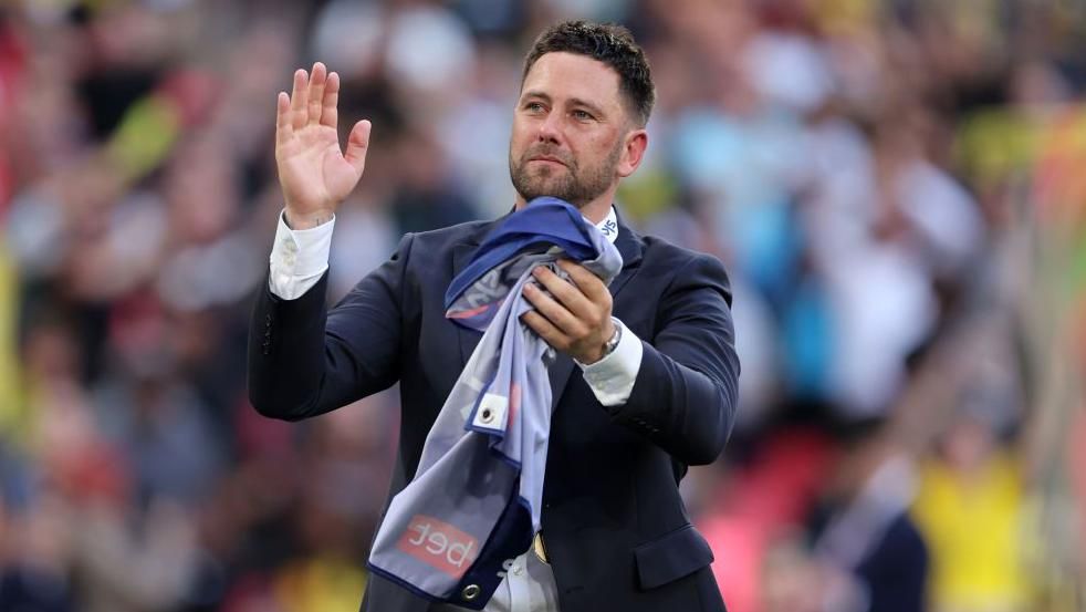 Des Buckingham applauds the fans after winning promotion with Oxford at Wembley