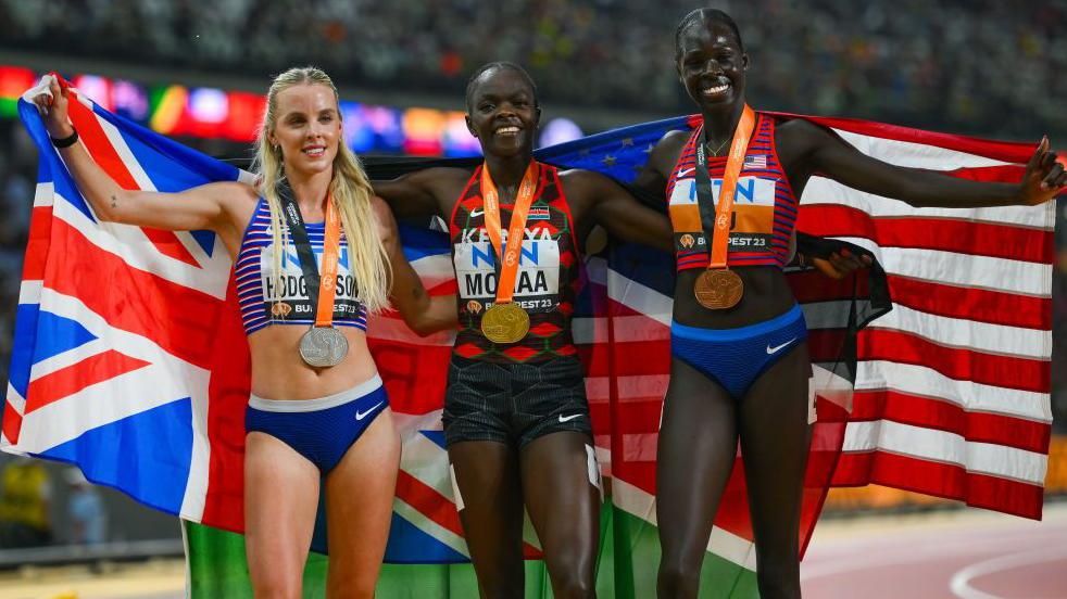 Keely Hodgkinson, Mary Moraa and Athing Mu pose with their World Championship medals in Budapest