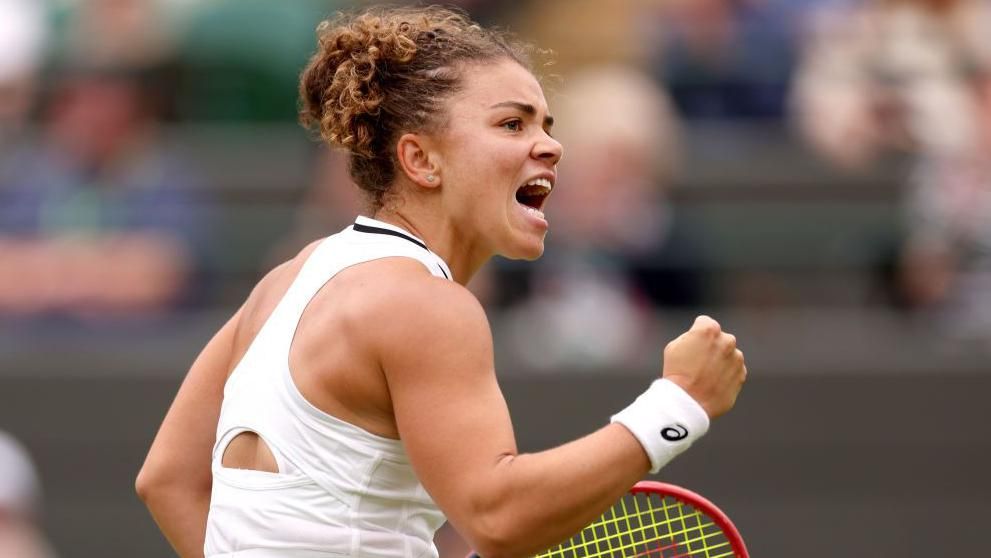 Jasmine Paolini pumps her fist in celebration