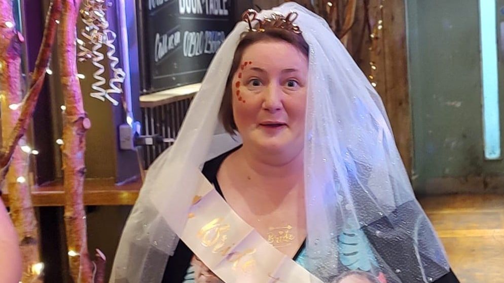 Sarah Tunnicliffe at her hen-do, wearing a veil