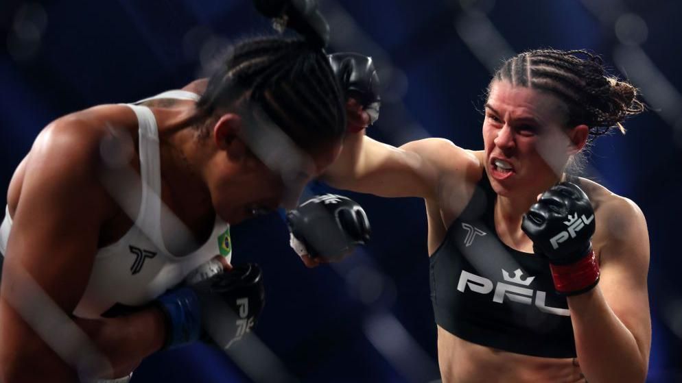 Savannah Marshall punches Mirela Vargas in an MMA bout