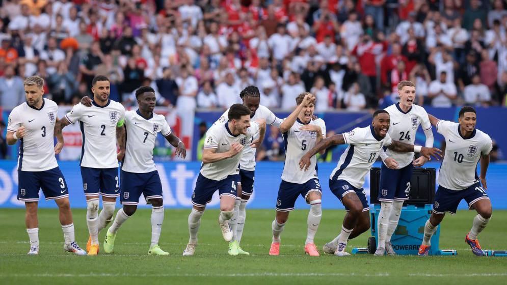 England players celebrate winning a penalty shootout against Switzerland at Euro 2024