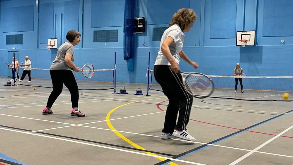 Sports club members playing tennis at the Great Yarmouth Marina Centre